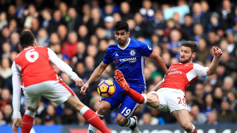 Diego Costa and Arsenal's Shkodran Mustafi battle for the ball at Stamford Bridge
