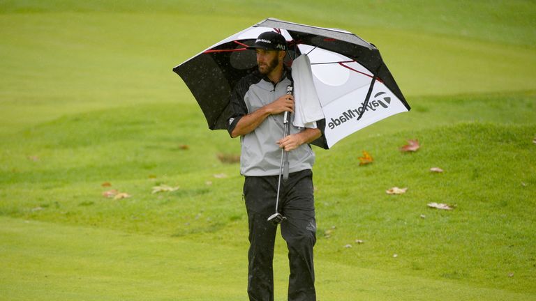 PACIFIC PALISADES, CA - FEBRUARY 18:  Dustin Johnson prepares to putt on the fourth hole during a continuation of the second round at the Genesis Open at R