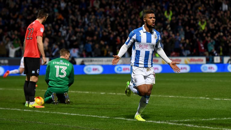 Elias Kachunga celebrates scoring Huddersfield's third