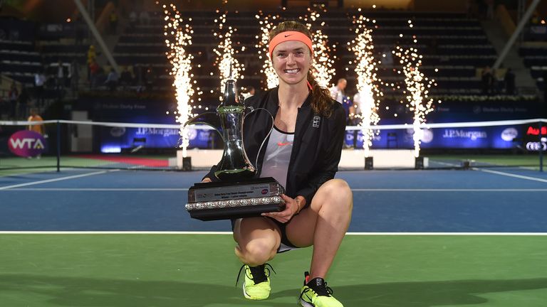 Elina Svitolina poses with the trophy in Dubai