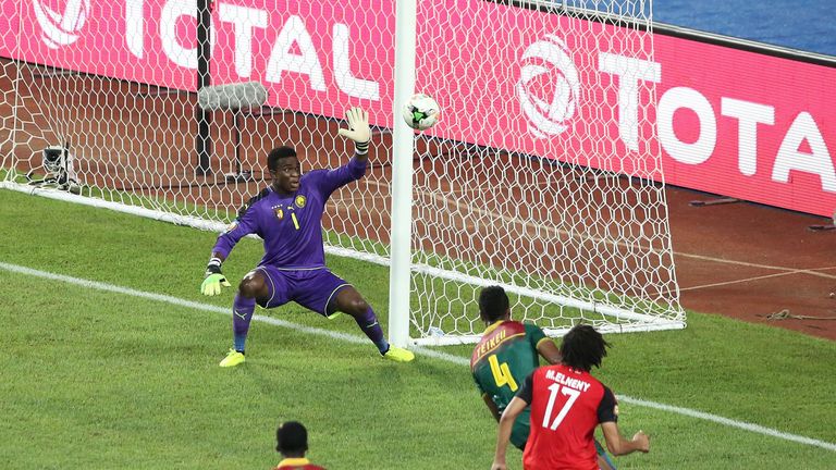 Cameroon's goalkeeper Fabrice Ondoa misses a goal by Egypt's midfielder Mohamed Elneny (17) during the 2017 Africa Cup of Nations final football match betw