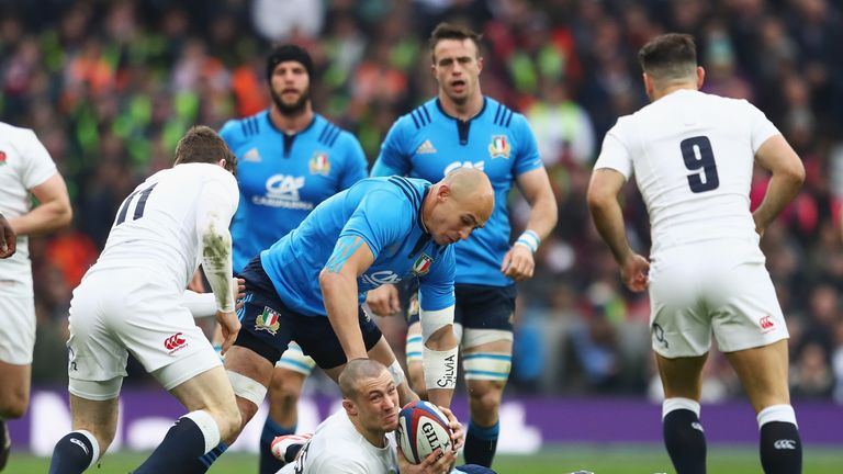 LONDON, ENGLAND - FEBRUARY 26: Mike Brown of England is tackled by Sergio Parisse of Italy during the RBS Six Nations match between England and Italy