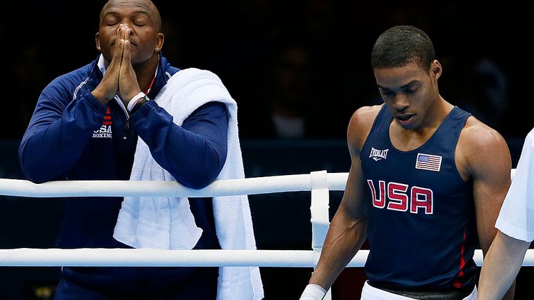 Errol Spence (R) of the USA and his corner await the verict against Krishan Vikas of India at London 2012.