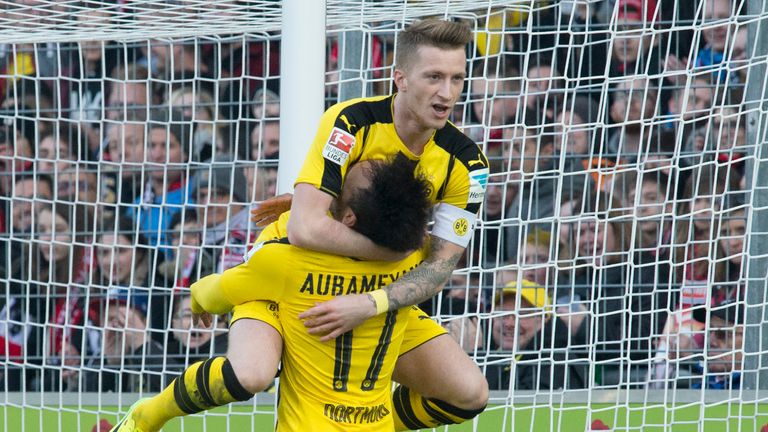 Dortmund's Gabonese forward Pierre-Emerick Aubameyang (R) is congratulated by Dortmund's forward Marco Reus