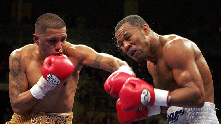 Fernando Vargas knocks back Shane Mosley with a left at the junior middleweight fight at the Mandalay Bay Events Center