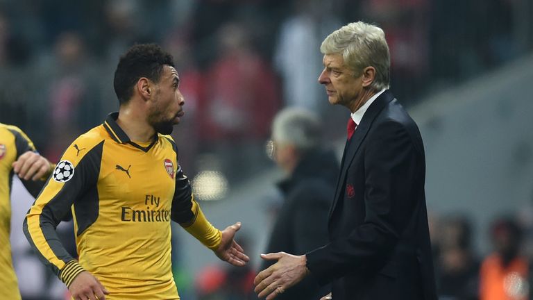 Arsenal's French midfielder Francis Coquelin (L) and Arsenal's French headcoach Arsene Wenger (R) speak together during the UEFA Champions League round of 