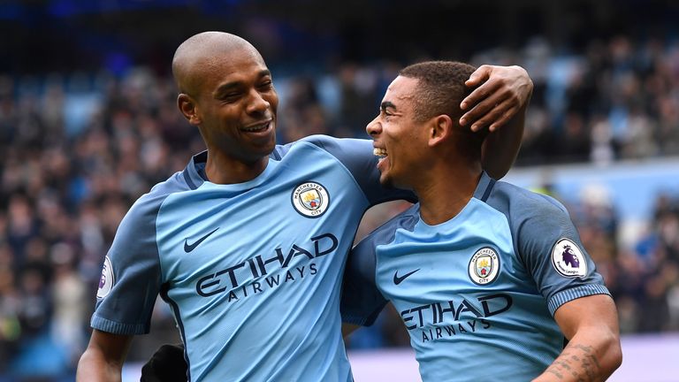 MANCHESTER, ENGLAND - FEBRUARY 05:  Gabriel Jesus of Manchester City celebrates scoring his sides first goal with Fernandinho of Manchester City during the