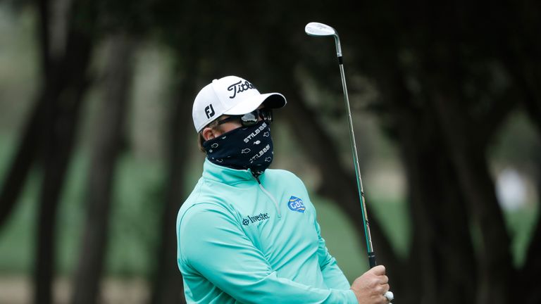 DUBAI, UNITED ARAB EMIRATES - FEBRUARY 03:  George Coetzee of South Africa hits his second shot on the 14th hole during the second round of the Omega Dubai