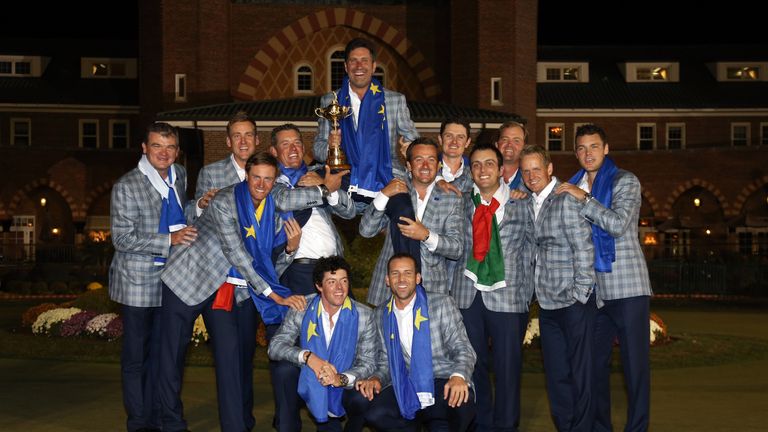 The European Ryder Cup team celebrate with the trophy after the Singles Matches for The 39th Ryder Cup at Medinah Country Club