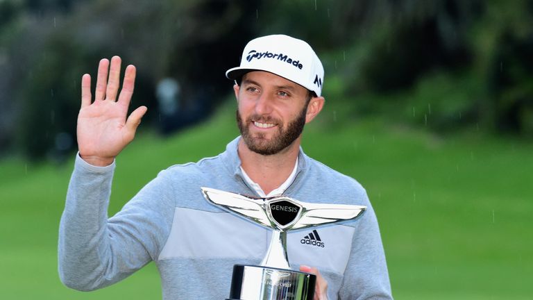 Dustin Johnson poses with the trophy during the final round at the Genesis Open at Riviera Country Club on February 1