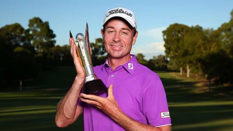 Brett Rumford of Australia poses with the trophy after winning the ISPS HANDA World Super 6 Perth at Lake Karrinyup Countr