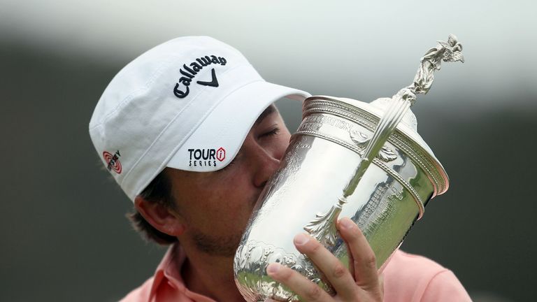 PEBBLE BEACH, CA - JUNE 20:  Graeme McDowell (R) of Northern Ireland kisses the trophy on the 18th green after winning the 110th U.S. Open at Pebble Beach 