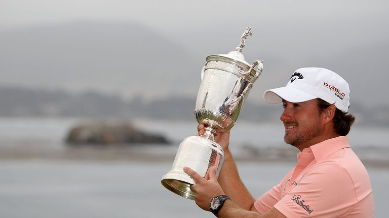 PEBBLE BEACH, CA - JUNE 20:  Graeme McDowell (R) of Northern Ireland celebrates with the trophy on the 18th green after winning the 110th U.S. Open at Pebb