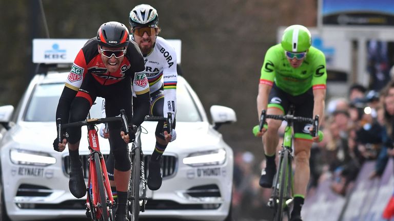 Greg Van Avermaet of BMC Racing Team beats Peter Sagan of Bora-Hansgrohe and Sep Vanmarcke of Cannondale to win Omloop Het Nieuwsblad