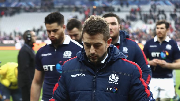PARIS, FRANCE - FEBRUARY 12:  Greig Laidlaw, the Scotland captain, walks off the pitch with his leg in a surgical boot during the RBS Six Nations match bet