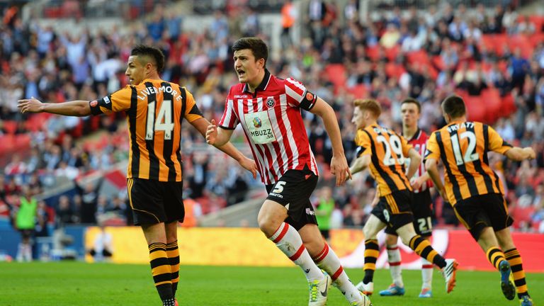 LONDON, ENGLAND - APRIL 13:  Harry Maguire of Sheffield United (5) reacts as Stephen Quinn of Hull City (29) scores their fourth goal during the FA Cup wit
