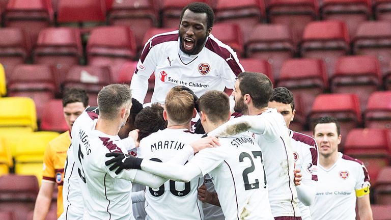 Hearts players celebrate their opening goal in the 3-0 victory at Motherwell