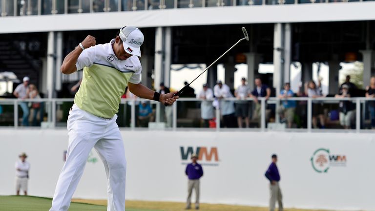 Hideki Matsuyama holes the winning birdie putt on the fourth playoff hole on the 17th green