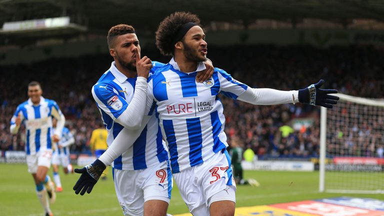 Huddersfield Town's Isaiah Brown celebrates with Elias Kachunga 