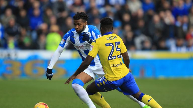 Huddersfield Town's Kasey Palmer and Leeds United's Ronaldo Vieira (right) battle for the ball during the Sky Bet Championship match at the John Smith's 
