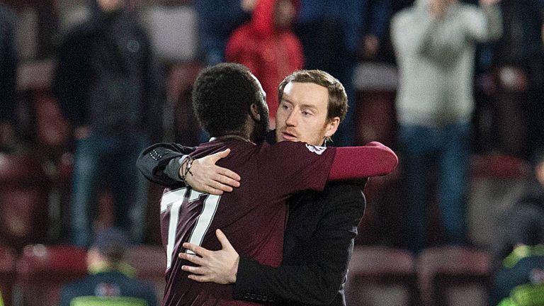 Hearts coach Ian Cathro (right) embraces Isma Goncalves at full time