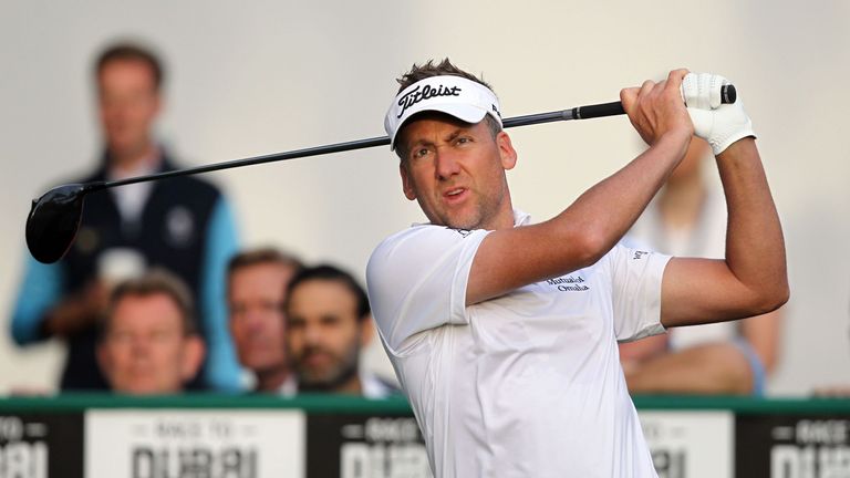 Ian Poulter of England follows his ball after playing a shot during the Dubai Desert Classic golf tournament at the Emirates Golf Club in Dubai on February