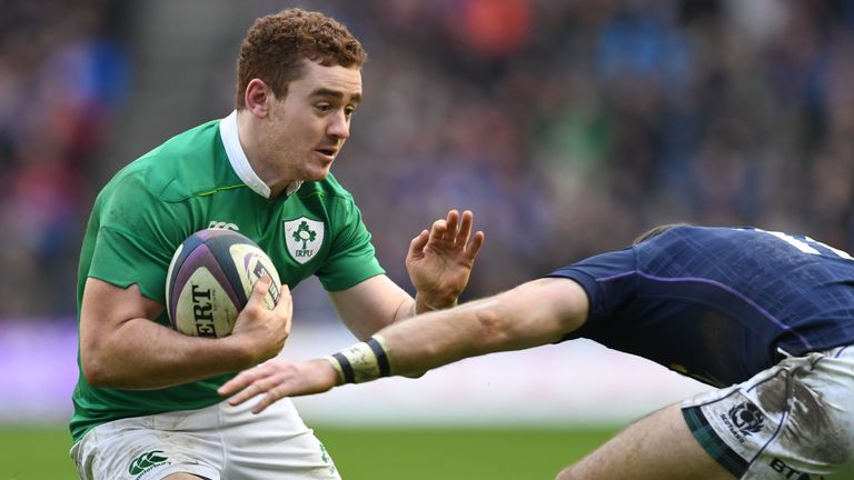 Ireland's fly-half Paddy Jackson tries to pass a tackle during the Six Nations international rugby union match between Scotland and Ireland at Murrayfield 