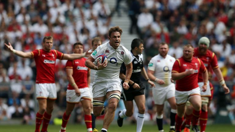 England's number 8 Jack Clifford (C) breaks free to run in a try during the international rugby union match between England and Wales at Twickenham Stadium