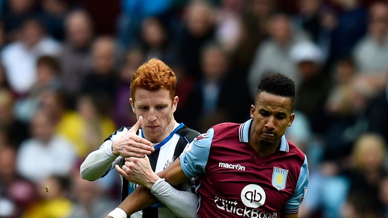BIRMINGHAM, ENGLAND - MAY 07:  Jack Colback of Newcastle United and Scott Sinclair of Aston Villa compete for the ball during the Barclays Premier League m