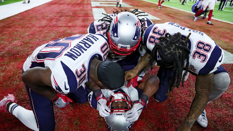 James White #28 of the New England Patriots celebrates with teammates after defeating the Atlanta Falcons 34-28 in overtime 
