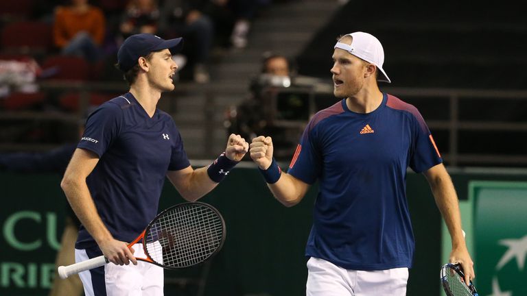 OTTAWA, ON - FEBRUARY 4: Jamie Murray and Dominic Inglot of Great Britain fist-bump after winning a set point against Vasek Pospisil and Daniel Nestor of C