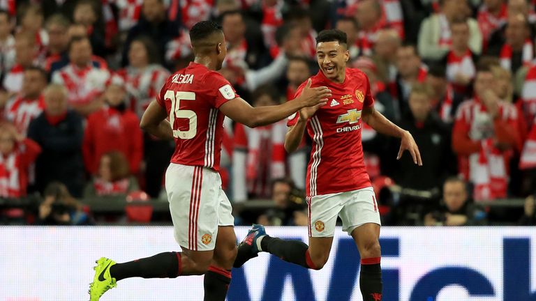 Jesse Lingard (right) celebrates with Antonio Valencia (left)