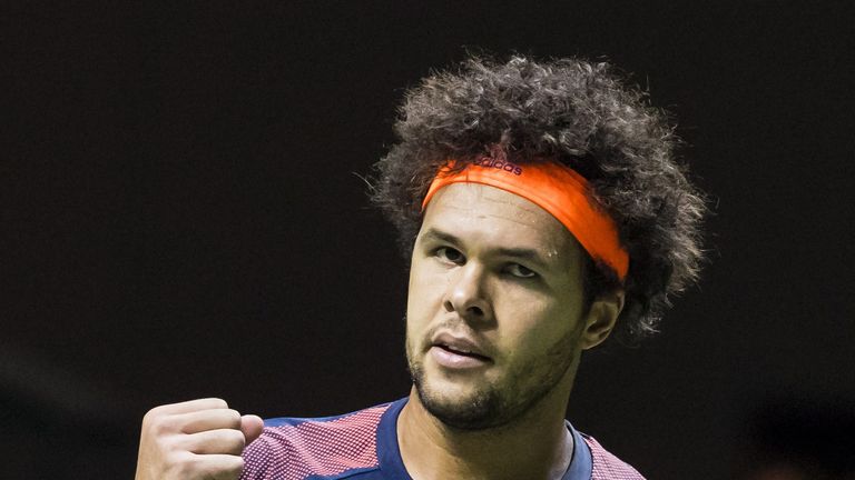 France's Jo-Wilfried Tsonga celebrates after winning his quarter final tennis match against Croatia's Marin Cilic during the ABN Amro World Tennis Tourname