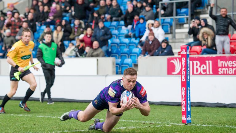 Salford Red Devils v Wigan Warriors - AJ Bell Stadium, Salford, England - Wigan's Joe Burgess dives over for a try against Salford.