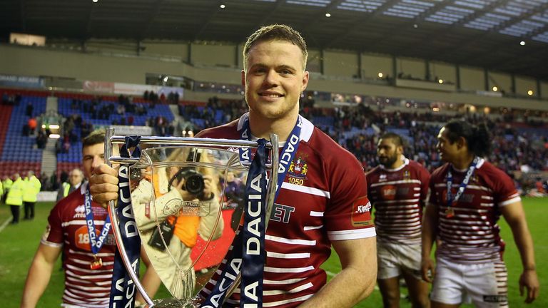 WIGAN, ENGLAND - FEBRUARY 19:  Joe Burgess of Wigan Warriors poses with the trophy during the Dacia World Club Challenge match between Wigan Warriors and C