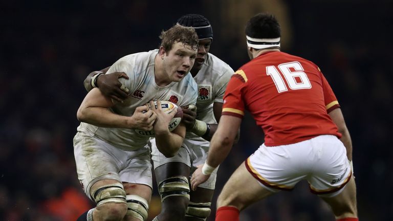 CARDIFF, WALES - FEBRUARY 11:  Joe Launchbury of England charges towards Scott Baldwin of Wales  during the RBS Six Nations match between Wales and England