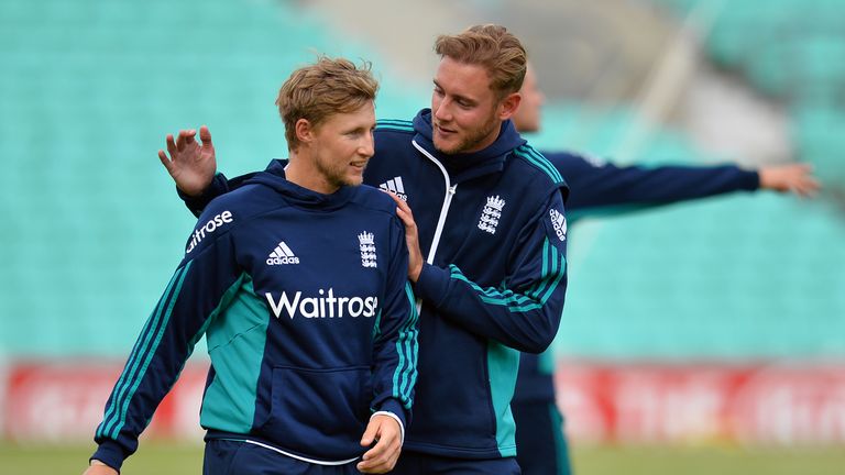 England's Joe Root (L) and Stuart Broad speak during a team training session at the Oval in London on August 10, 2016, on the eve of the start of the fourt