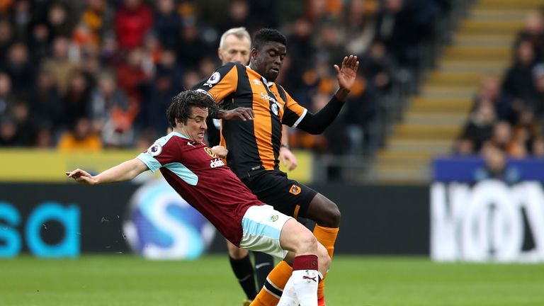 HULL, ENGLAND - FEBRUARY 25: Joey Barton of Burnley (L) tackles Alfred N'Diaye of Hull City (R) during the Premier League match between Hull City and Burnl