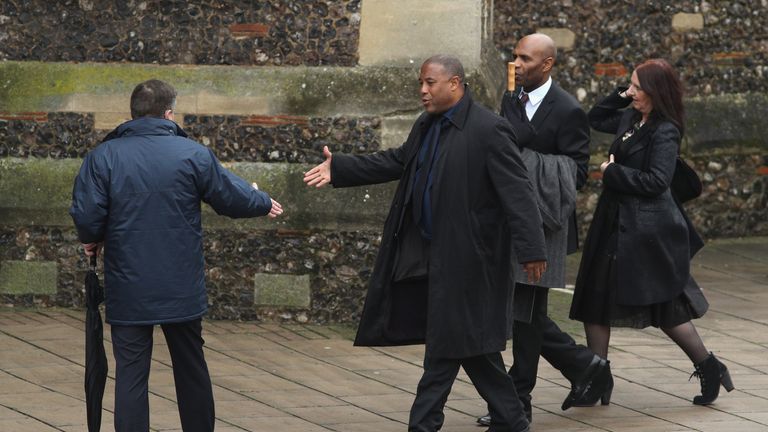 WATFORD, ENGLAND - FEBRUARY 01:  John Barnes (2L) and Luther Blissett (2R) arrive to the funeral of former England manager Graham Taylor at St Mary's Churc