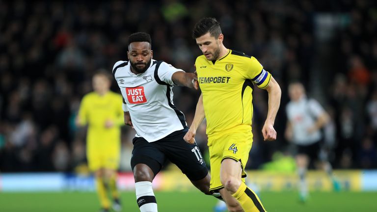 Burton Albion's John Mousinho (right) and Derby County's Darren Bent battle for the ball 