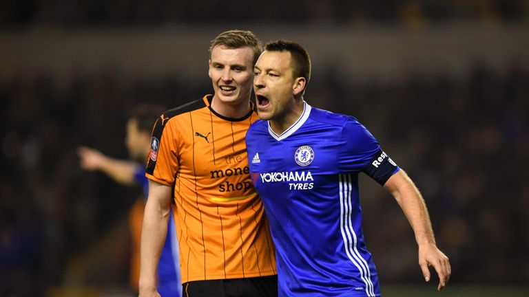 WOLVERHAMPTON, ENGLAND - FEBRUARY 18:  Jon Dadi Bodvarsson of Wolves (L) and John Terry of Chelsea (R) exchange words during The Emirates FA Cup Fifth Roun