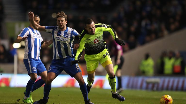 Reading's Jordon Mutch (right) is tackled by Brighton and Hove Albion's Dale Stephens