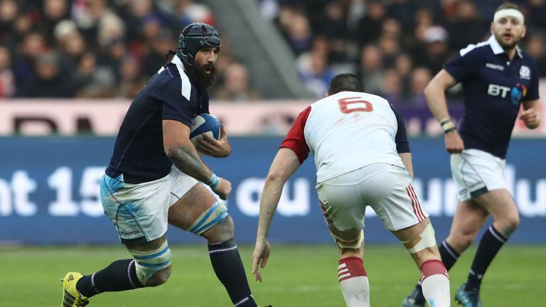 PARIS, FRANCE - FEBRUARY 12:  Josh Strauss of Scotland charges towards Loann Goujon of France during the Six Nations match between France and Scotland