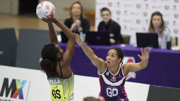 Thunder's Joyce Mvula takes aim under pressure from Vicki Oyesola