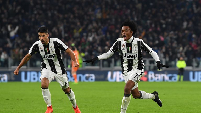 TURIN, ITALY - FEBRUARY 05:  Juan Cuadrado (L) of Juventus FC celebrates after scoring the opening goal with team mates Sami Khedira during the Serie A mat