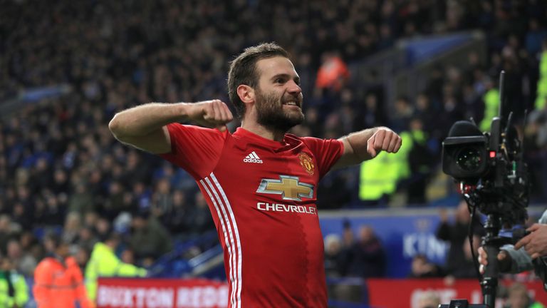Manchester United's Juan Mata celebrates scoring his side's third goal of the game during the Premier League match at Leicester