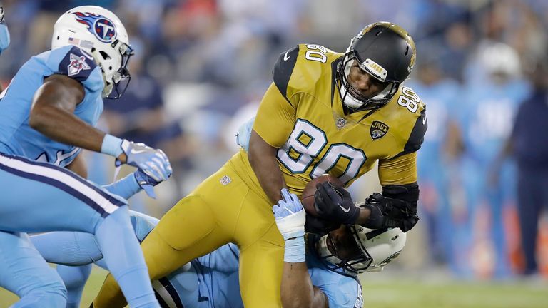 NASHVILLE, TN - OCTOBER 27: Julius Thomas #80 of the Jacksonville Jaguars is tackled by Avery Williamson #54 of the Tennessee Titans during the third quart