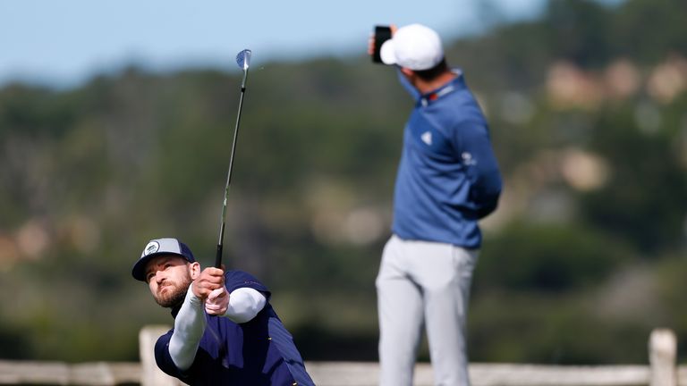 Justin Rose snaps a selfie as Justin Timberlake tees off on the seventh, and his ball lipped out for a hole-in-one