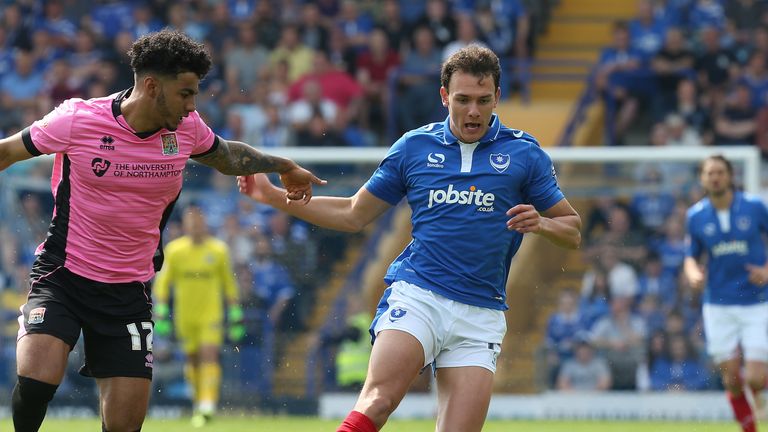 PORTSMOUTH, ENGLAND - MAY 07:  Kal Naismith of Portsmouth attempts to control the ball watched by Josh Lelan of Northampton Town during the Sky Bet League 
