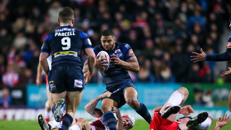 Leeds' Kallum Watkins is tackled by St Helens' Theo Fages.